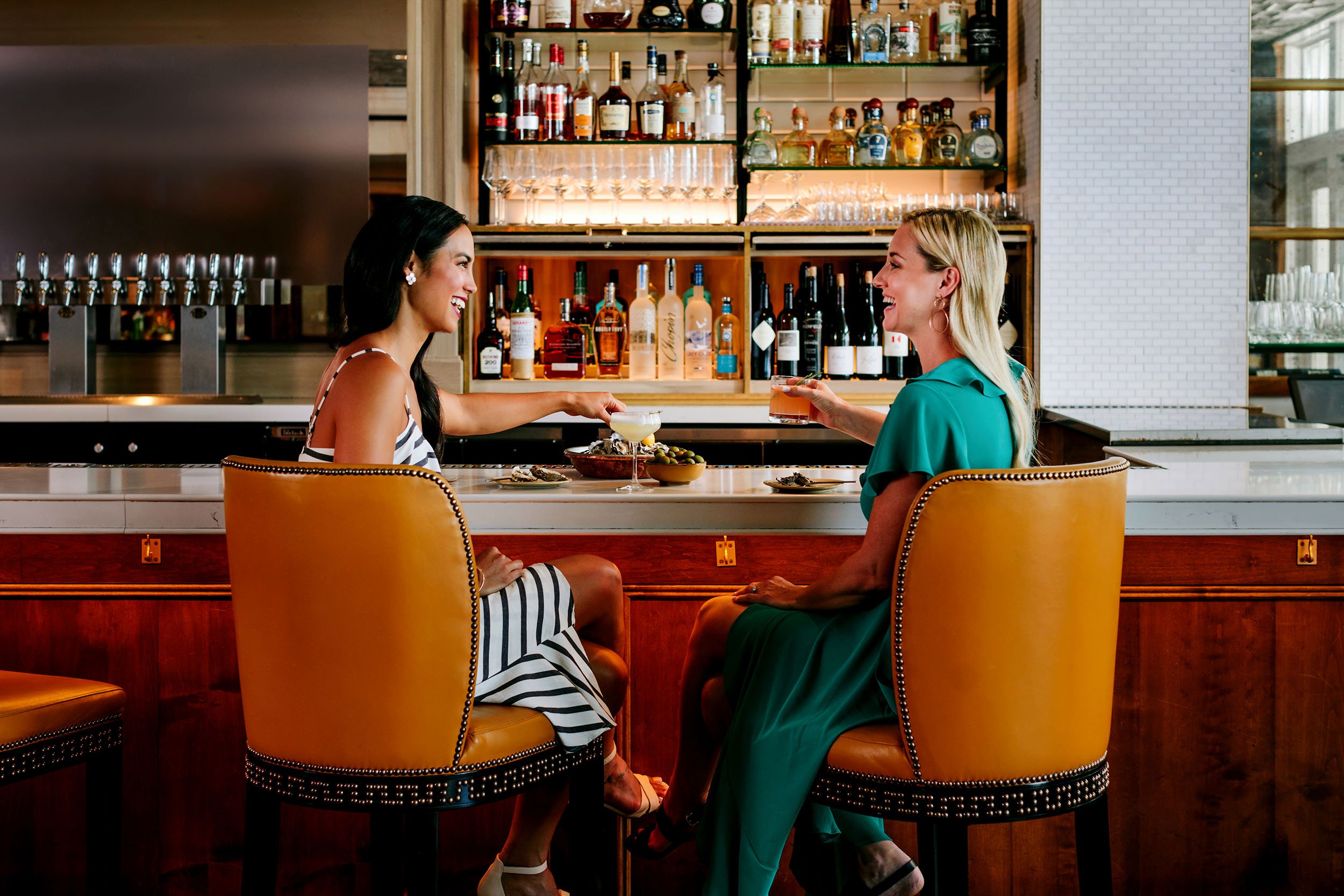 two women drinking at the bar